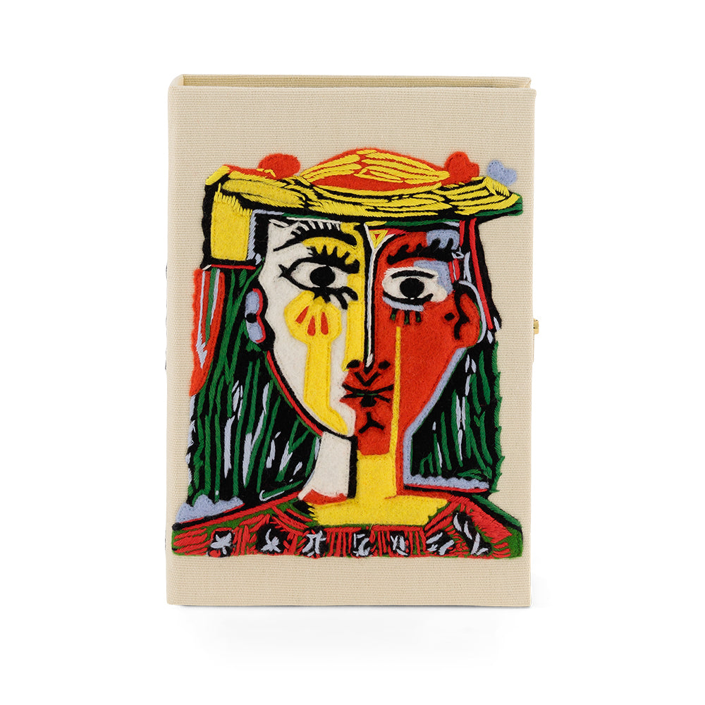 Tête de femme avec un chapeau à pompons handbag 