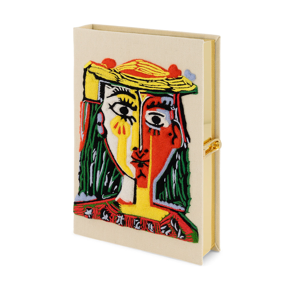 Tête de femme avec un chapeau à pompons handbag 